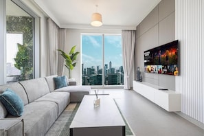Stunning Downtown 4BR Sky High Luxury | Living area | 55-inch Smart TV with cable channels, Netflix, Hulu