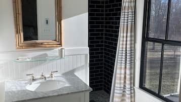 Shower, hair dryer, towels, toilet paper