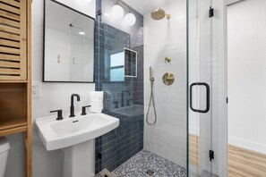Shower, hair dryer, towels, soap