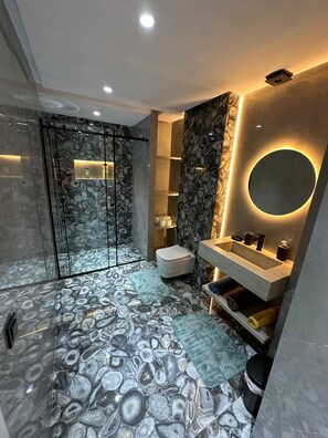 Shower, towels, soap, toilet paper