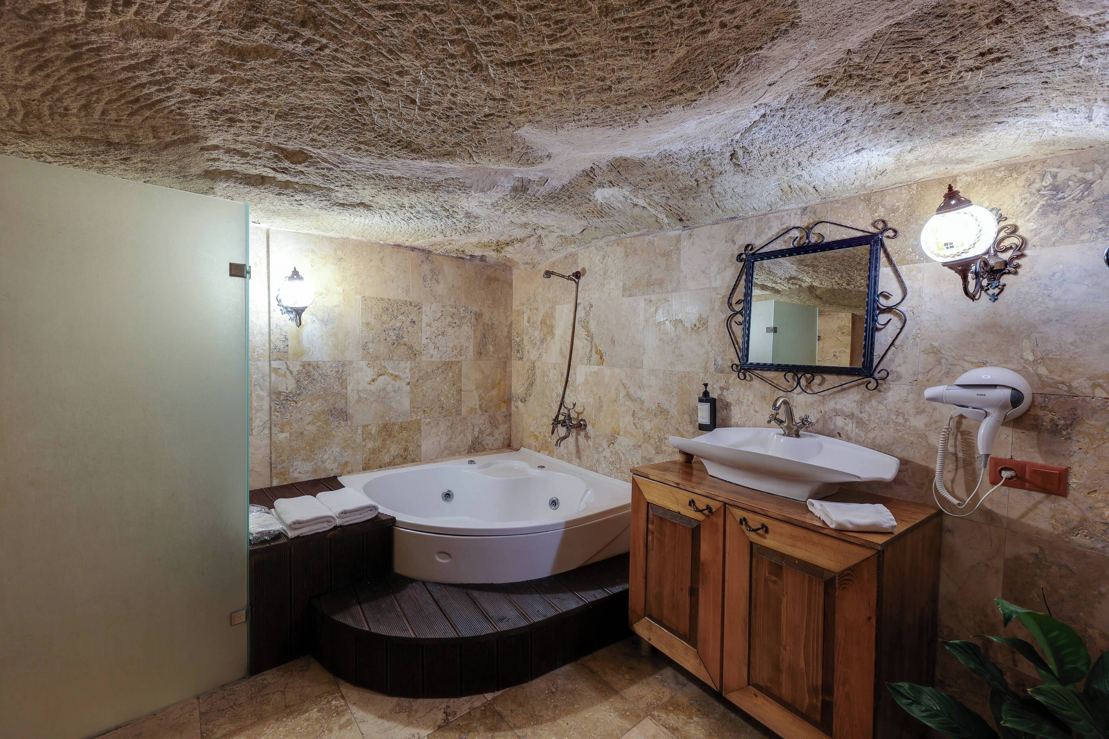 Hidden Library Magara Suite | Bathroom | Shower, designer toiletries, hair dryer, towels