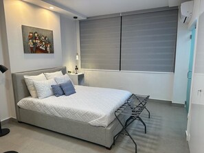 1 bedroom, desk, iron/ironing board, travel crib