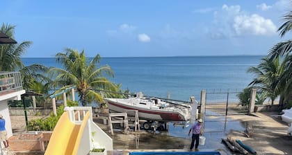 9 Charmin beachfront suites with 2 swimming pools in cool Trujillo.
