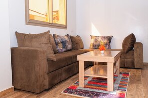 Kolmen hengen comfort-huone | Oleskelualue