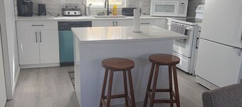 “Stylish Home Near Social Amenities | Free Parking + Garage” in SW Area, Calgary