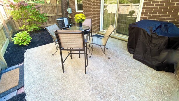 A patio with a table and chairs, a grill, and a potted plant. - Emerald Escape - POOL! (Beckley)