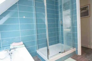Shower, hair dryer, towels, toilet paper