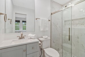 Shower, hair dryer, towels, soap