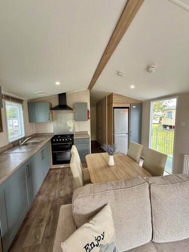 Welcoming family caravan on large pitch near beautiful New Quay in West Wales