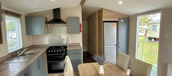 Welcoming family caravan on large pitch near beautiful New Quay in West Wales