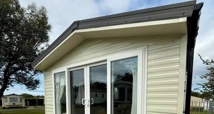 Welcoming family caravan on large pitch near beautiful New Quay in West Wales