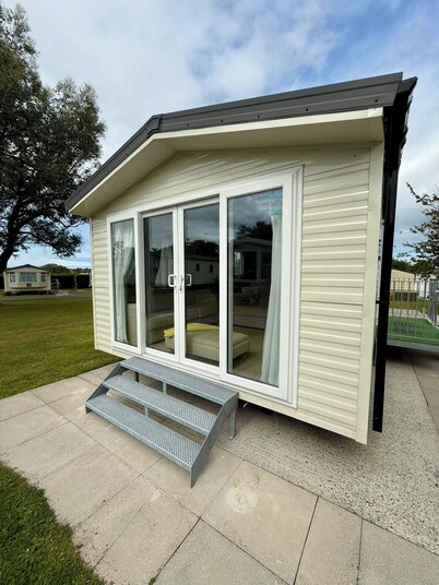 Welcoming family caravan on large pitch near beautiful New Quay in West Wales