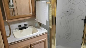 Shower, hair dryer, towels, soap