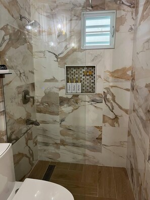 Shower, hair dryer, towels, soap