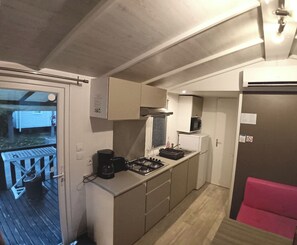 Fridge, microwave, stovetop, coffee/tea maker