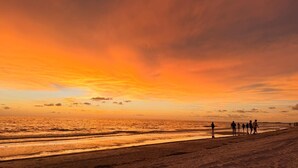 A beach scene with a sunset.