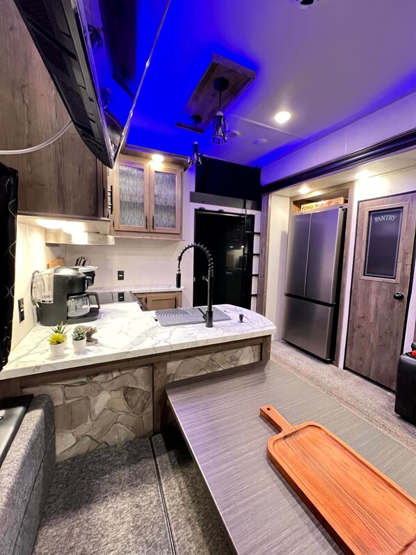 Fridge, microwave, stovetop, coffee/tea maker