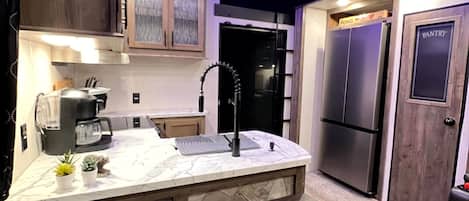 Fridge, microwave, stovetop, coffee/tea maker