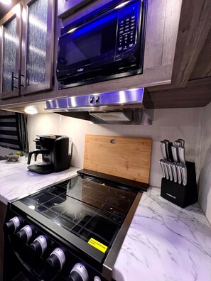 Fridge, microwave, stovetop, coffee/tea maker