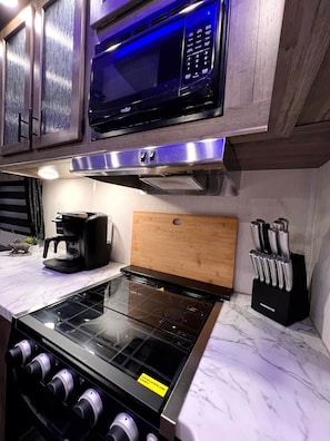 Fridge, microwave, stovetop, coffee/tea maker