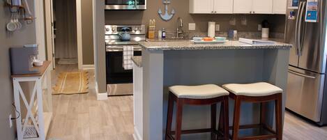 Coffee/tea maker, fridge, microwave, oven