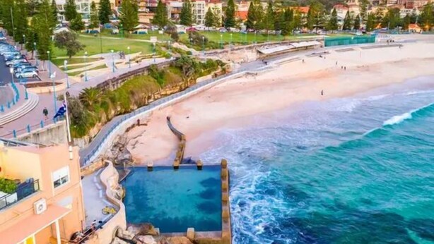 A coastal hotel with a swimming pool, beach access, and a view of the cityscape. - Dolphin Sands; A 3-bedroom apartment in Coogee Beach, barefoot walk to sand. (Coogee)