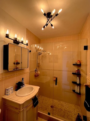 Shower, hair dryer, towels, soap