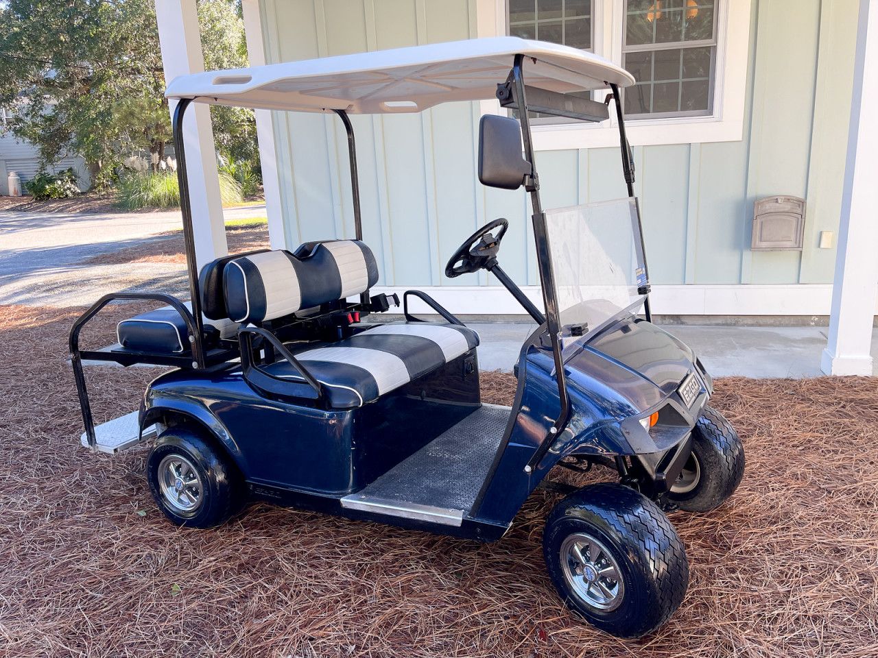 Optional golf cart rental in the garage with seatbelts