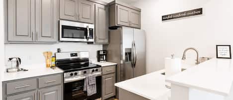 Coffee/tea maker, fridge, microwave, oven