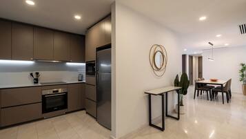 Fridge, microwave, cookware/dishes/utensils, dining tables