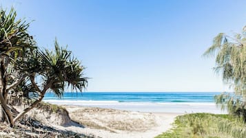 On the beach, sun-loungers, beach towels