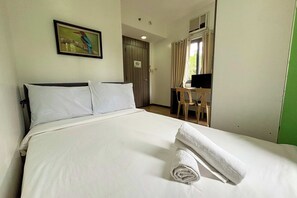 Habitación Deluxe | Escritorio, wifi gratis, ropa de cama