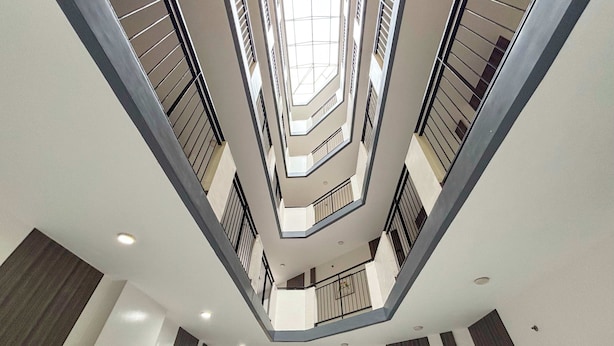 A multi-level atrium with a central open space and balconies. - Casa Lily Hotel Quezon City (Quezon City)