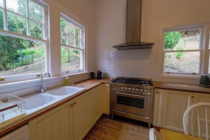 Full-sized fridge, toaster, rice cooker, cookware/dishes/utensils
