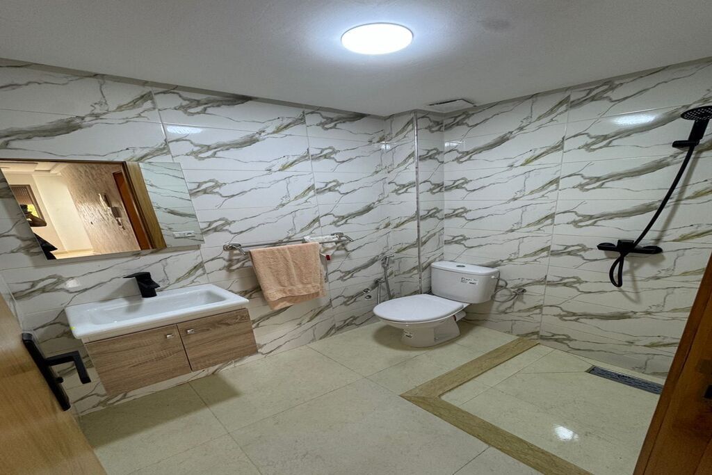 Shower, towels, soap, toilet paper