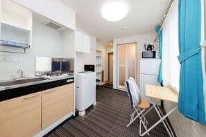 Apartment | Private kitchen | Mini-fridge, microwave, stovetop, cookware/dishes/utensils