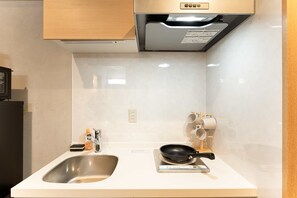 Apartamento conforto, sacada, vista para a cidade | Cozinha privada