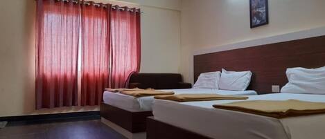 Deluxe Quadruple Room, City View | Desk, free WiFi