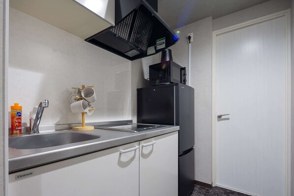 Habitación Confort, balcón, vista a la ciudad | Cocina privada