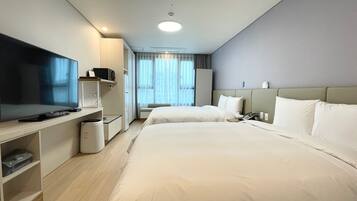 Family Twin Room, City View | In-room safe, laptop workspace, soundproofing, iron/ironing board