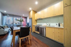 Fridge, coffee/tea maker, cookware/dishes/utensils