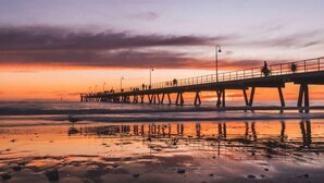 A pier extending into a body of water during sunset. - Blackbird at Arlo`s—Heritage meets Designer Charm (Glenelg South)