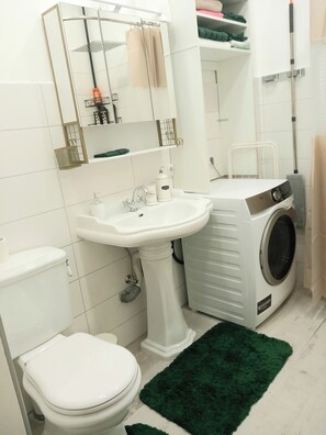 Shower, hair dryer, towels, soap