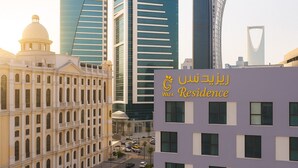 A modern building with a sign reading "Wafa Residence" in Arabic and English. - Wafa Residence (Riyadh)