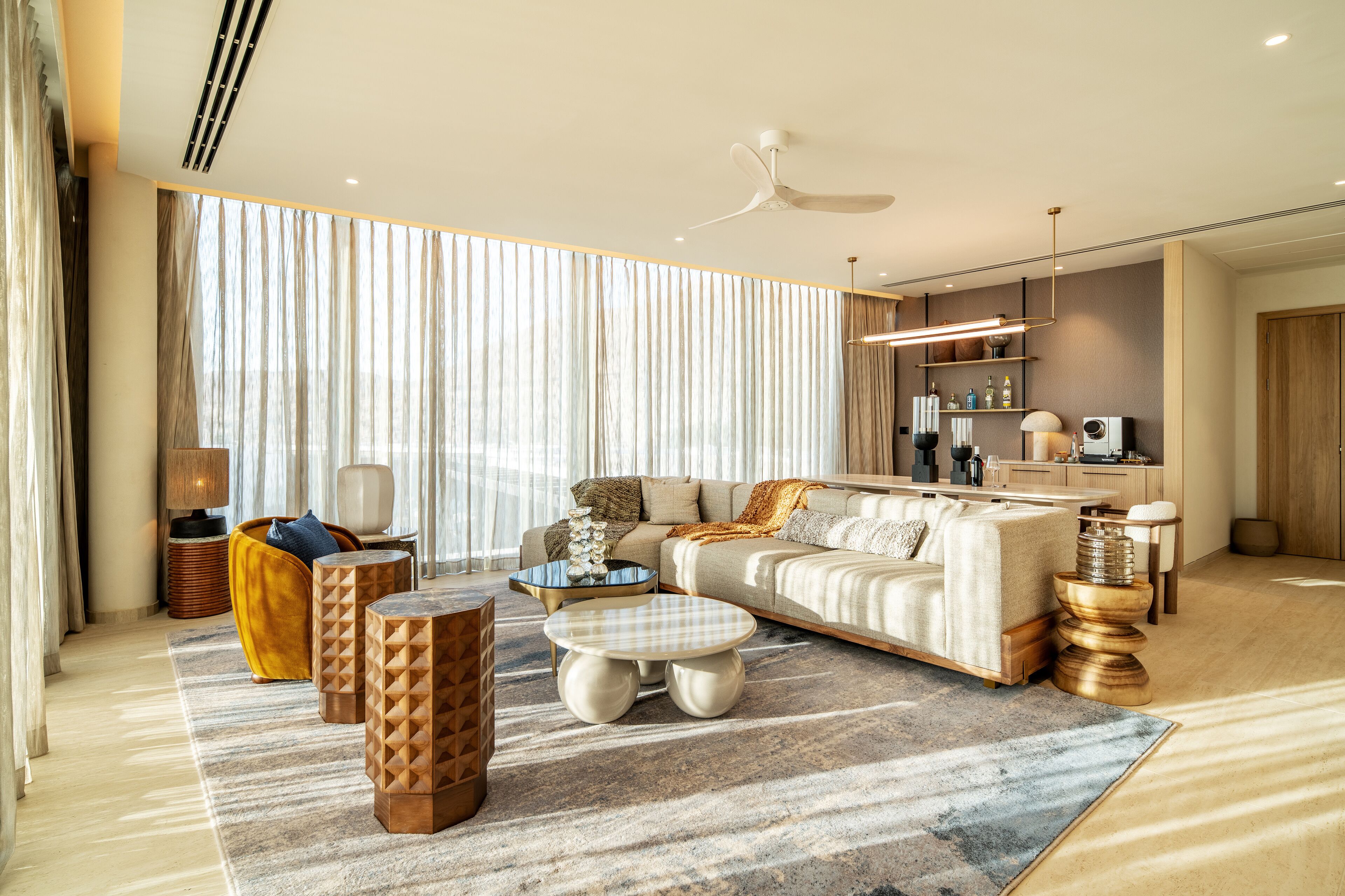 A modern living room with a sofa, coffee table, and decorative items.