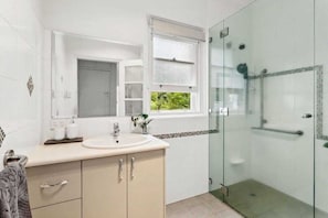 Shower, hair dryer, towels, soap