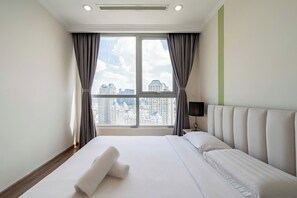 Luxury Apartment, Balcony, City View | Desk, blackout drapes, soundproofing, iron/ironing board