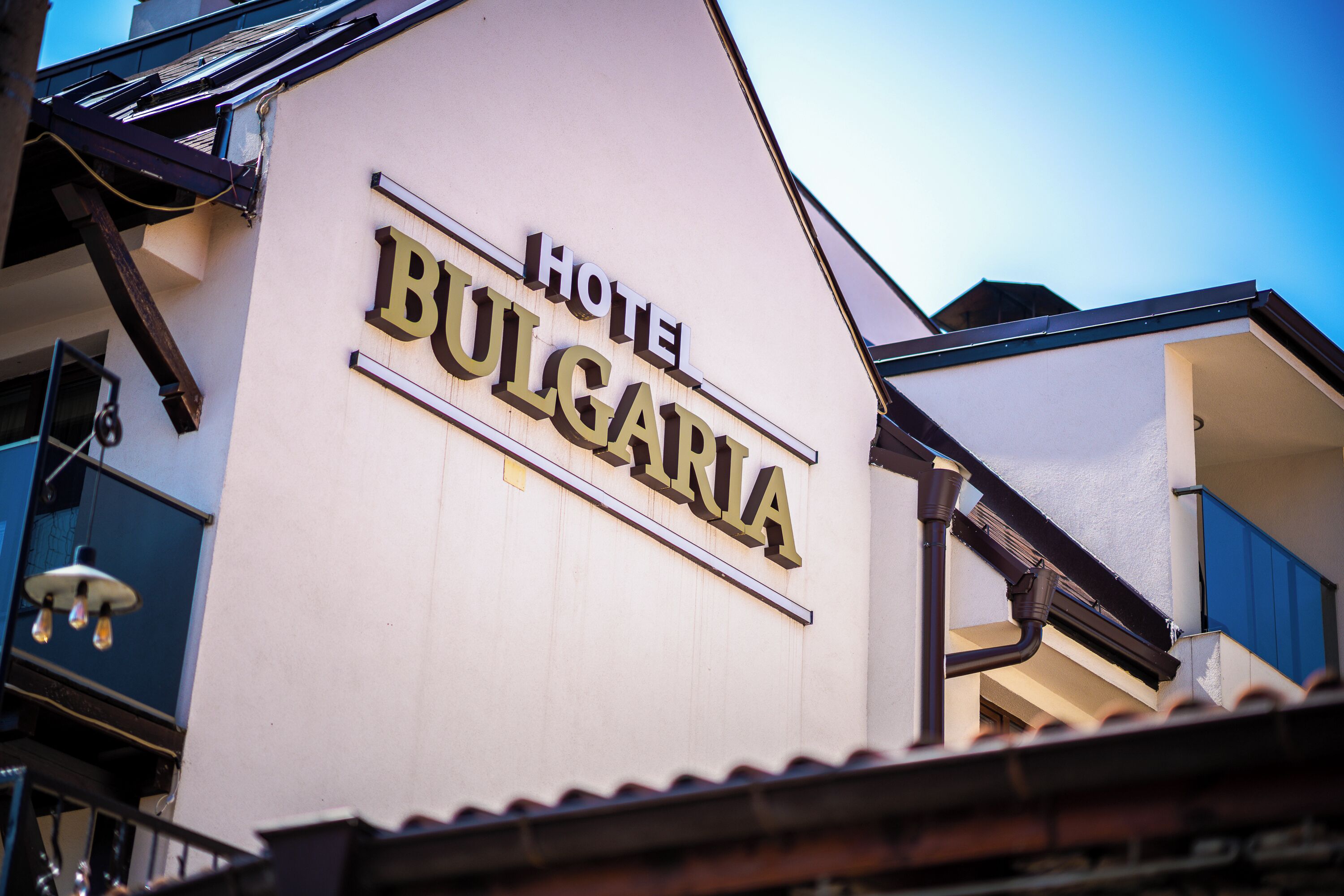 A hotel sign with the name "Hotel Bulgaria" on a building facade.