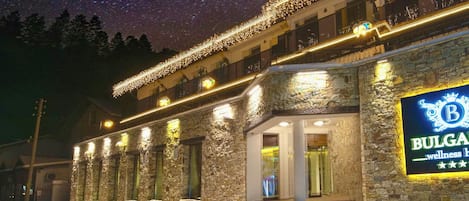 A stone building with a sign reading "Bulgaria wellness hotel."