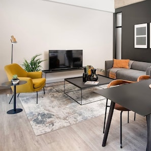 Apartamento luxo, 1 quarto, vista para a cidade | Área de estar